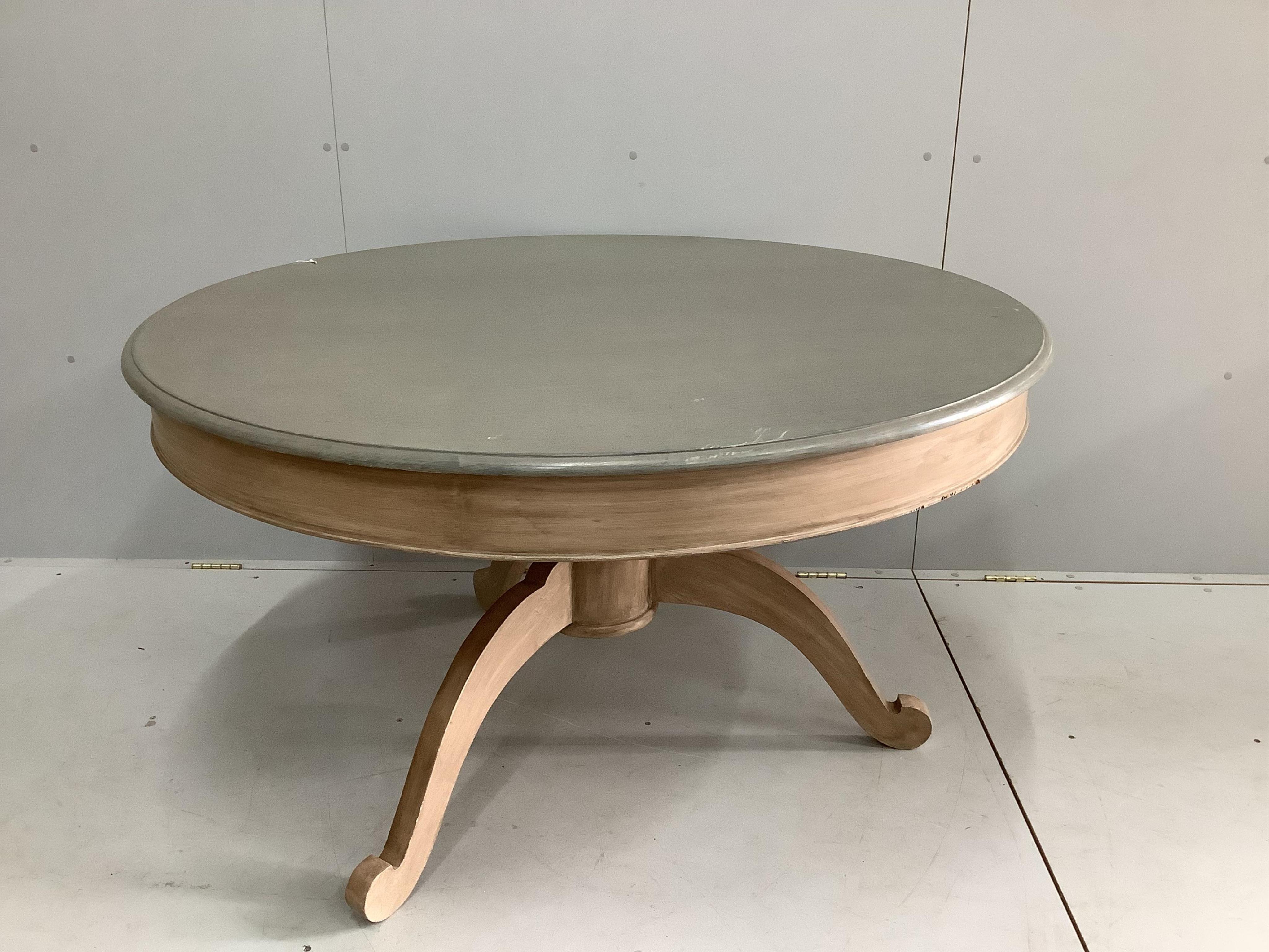 An Oka Furniture 'Arthur' circular table, diameter 130cm, height 74cm and six Oka French style limed oak chairs. Condition - good